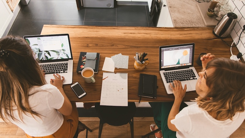 two people comparing websites