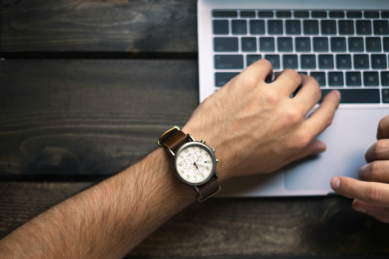 person looking at their watch