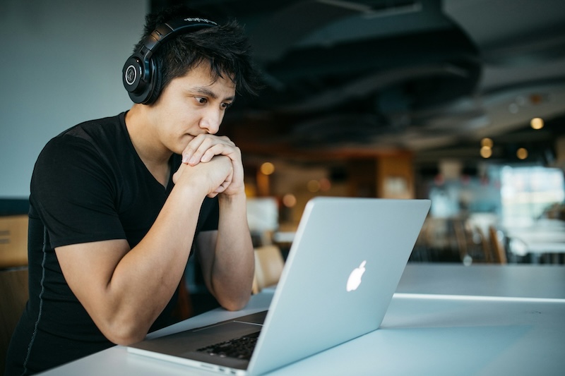 man looking at laptop